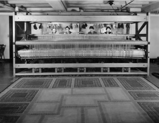 Studio Loja Saarinen weavers seated at one of the larger looms.  L to R: Elizabeth Edmark, Marie Bexell, Peggy Broberg, Gerda Nyberg.  May, 1935.  Cranbrook Archives. 