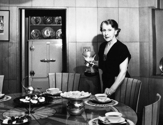 Loja Saarinen sets the table for guests.  Saarinen House, 1930-1940.  Cranbrook Archives.  