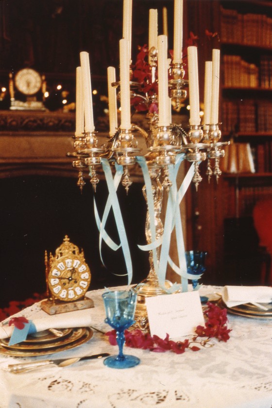 A 1988 Holiday Tables display features a candelabra and antique clock.  1988, Cranbrook Archives. 