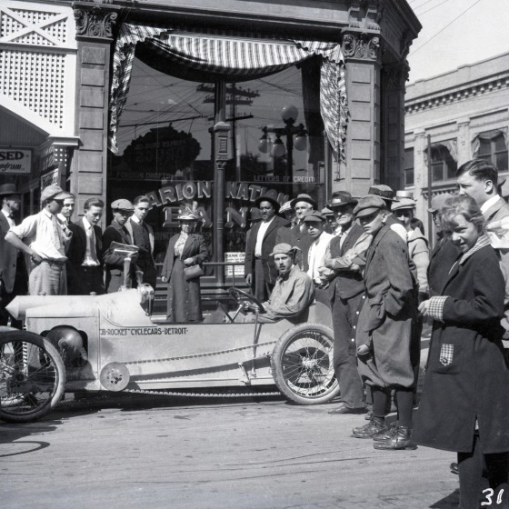 James Scripps Booth showing off the JB Rocket prototype in Indianapolis, the conclusion of a test-drive from Detroit to Indiana, 1913. Cranbrook Archives. 