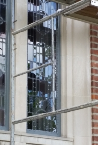 Glaziers from Thompson Art Glass reinstalling the window.